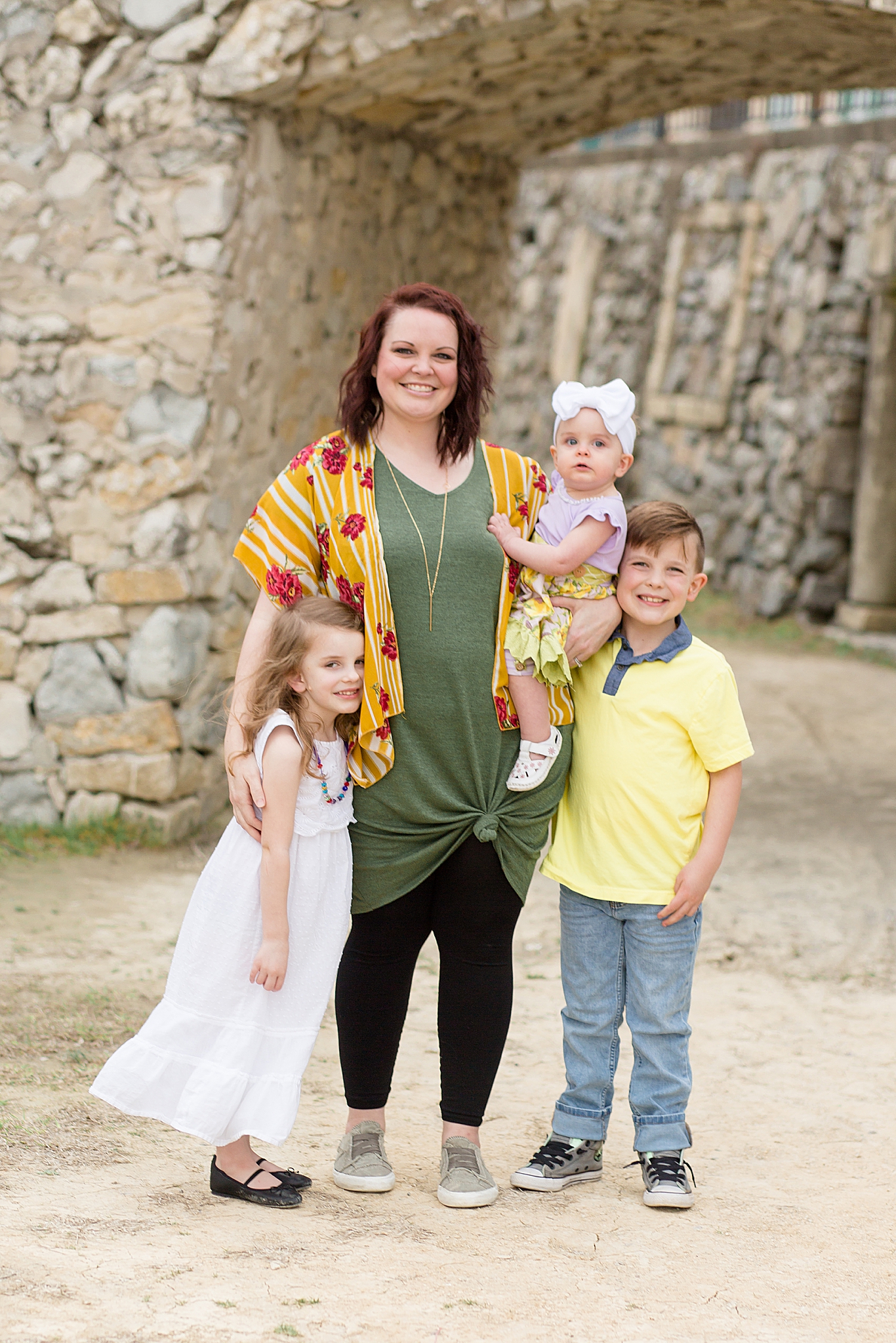 mom hugs children during Adriatica Village family portraits