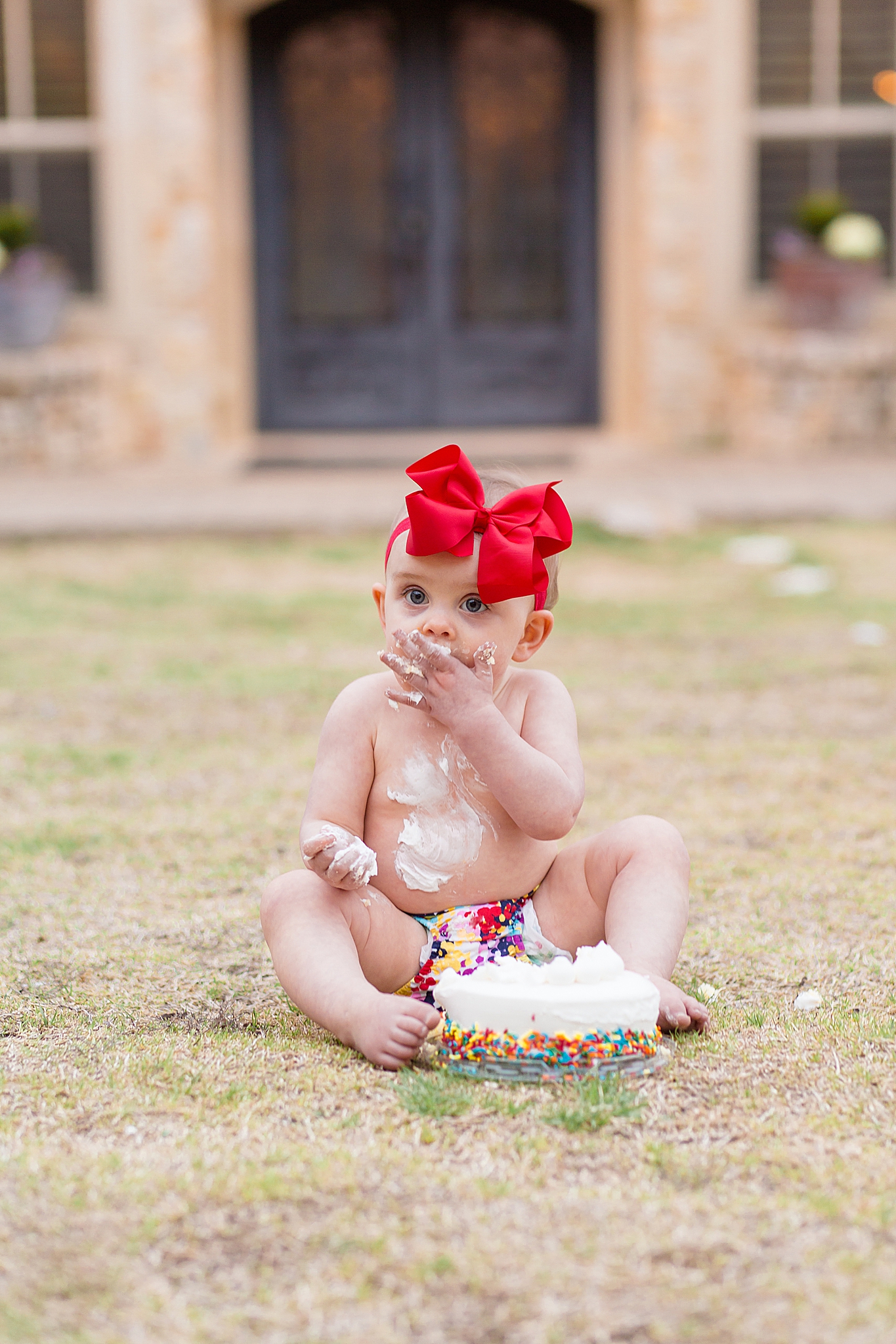 McKinney family photographer captures 1 year old smash cake session in the spring at Adriatica Village in McKinney, TX