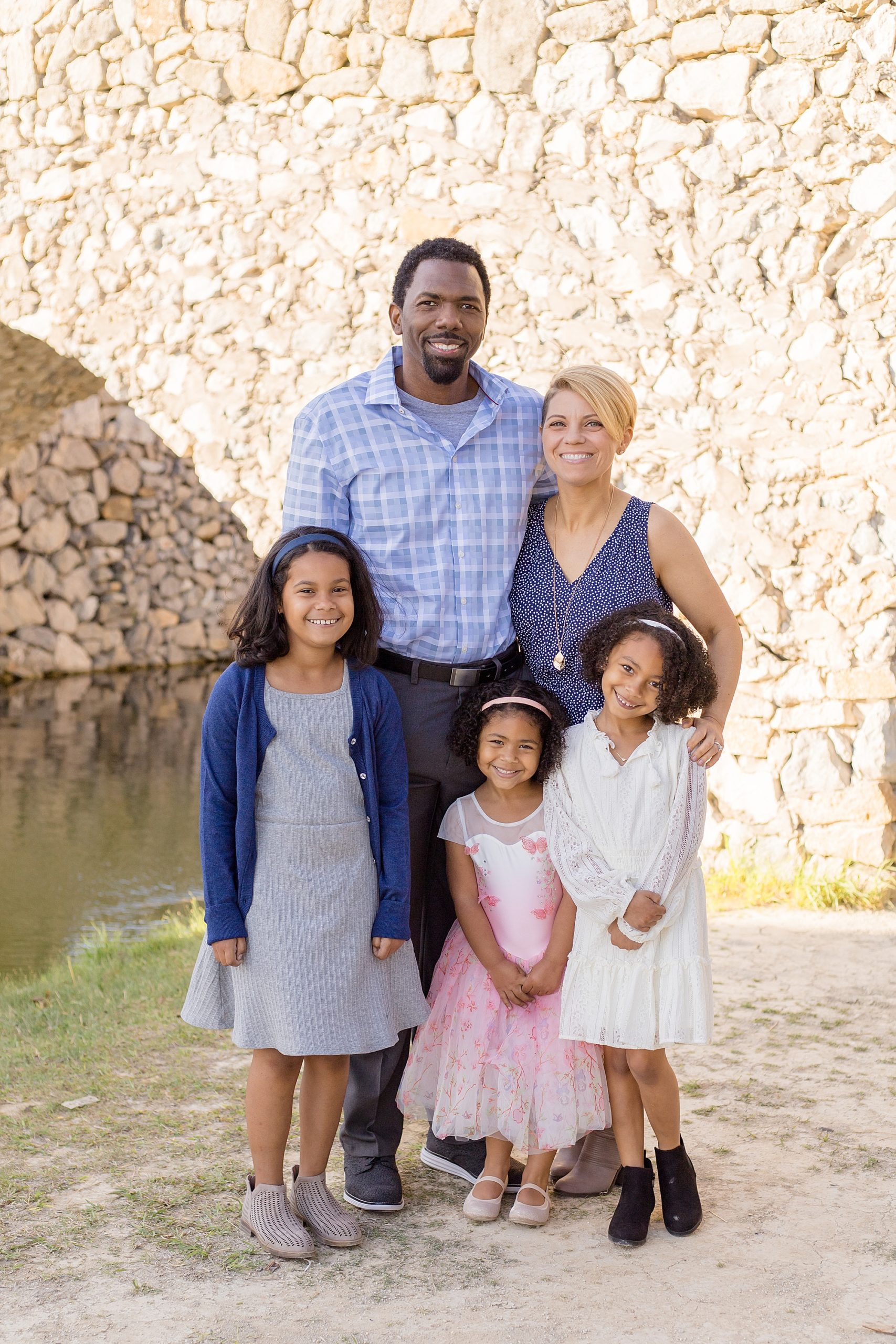 family of 5 poses for family portrait session in McKinney TX with Wisp + Willow Photography Co. 