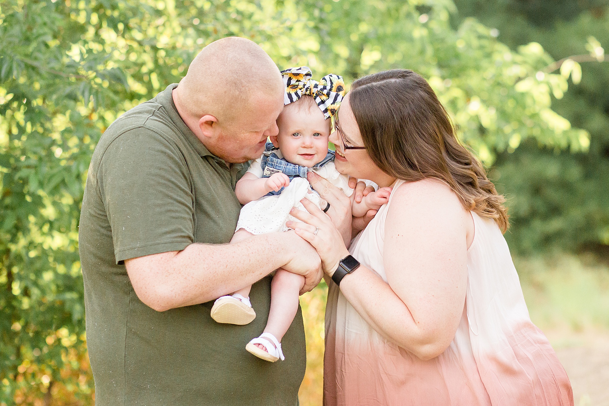 mom and dad pose with 6 month old daughter for summer portrait session with Wisp + Willow Photography Co.