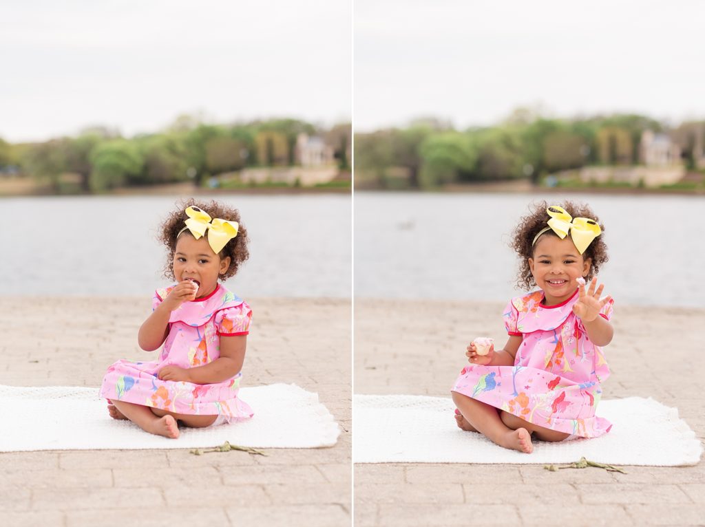 girl enjoys cupcake for third birthday during session with Wisp + Willow Photography Co.