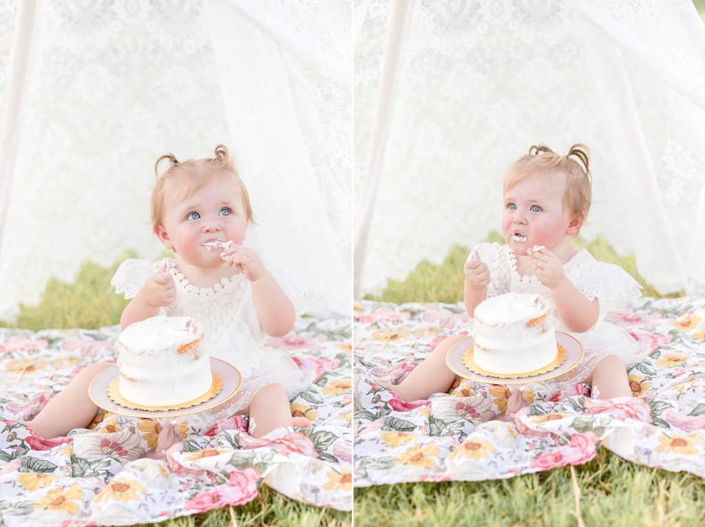 1 year old baby girl eats first birthday cake during smash cake session with McKinney milestone photographer Wisp + Willow Photography Co.