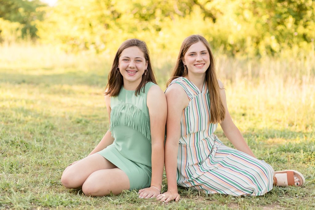 siblings pose together for family portrait session with wisp + willow photography co