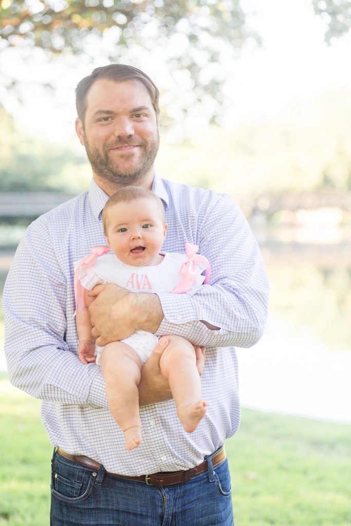 dad holds daughter for family portrait session with wisp + willow photography co.
