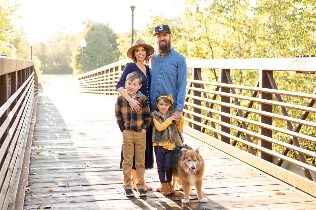 Family of 4 poses on bridge at Pinkerton Park with Franklin photographer Wisp + Willow Photography Co. 