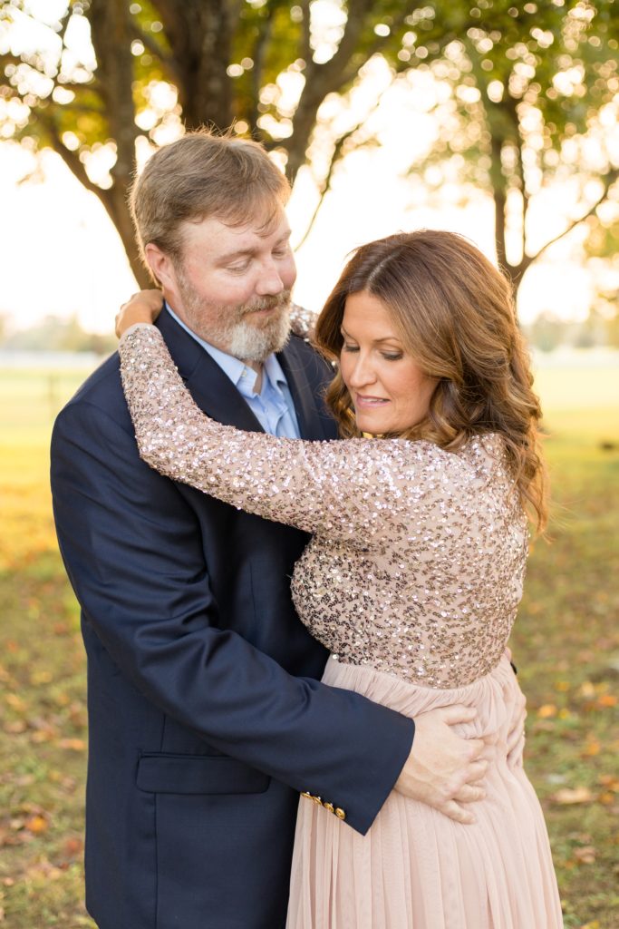 Mom and dad pose together during fall family portrait session with Wisp + Willow Photography Co. at Harlinsdale Farm in Franklin, TN. It's important to us to always try to capture mom and dad by themselves because the relationship between parents is so important!
