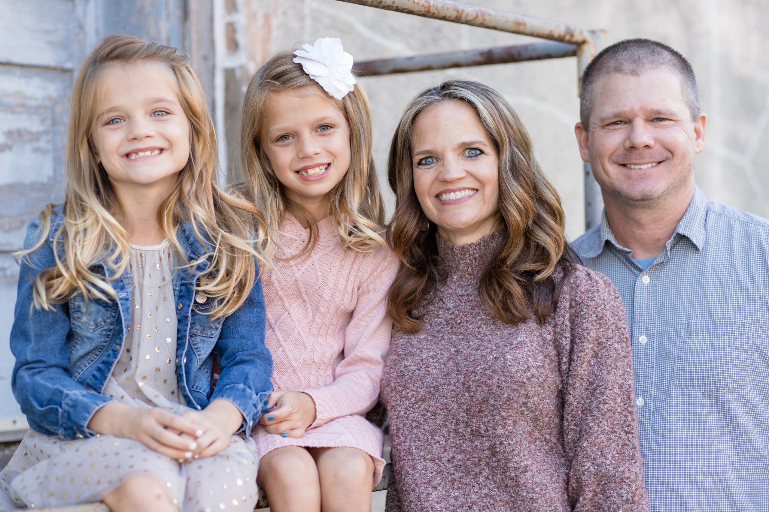 The Hillard family poses for family portrait session with Wisp + Willow Photography Co. in the historic downtown McKinney Square.