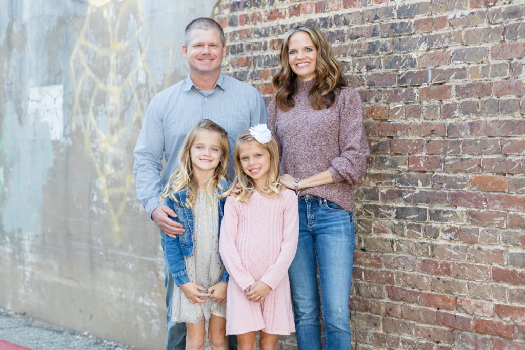 Family of four poses for fall family portrait session with Wisp + Willow Photography Co. The Hillard family had so much fun during their session! Click to see more from this family portrait session!