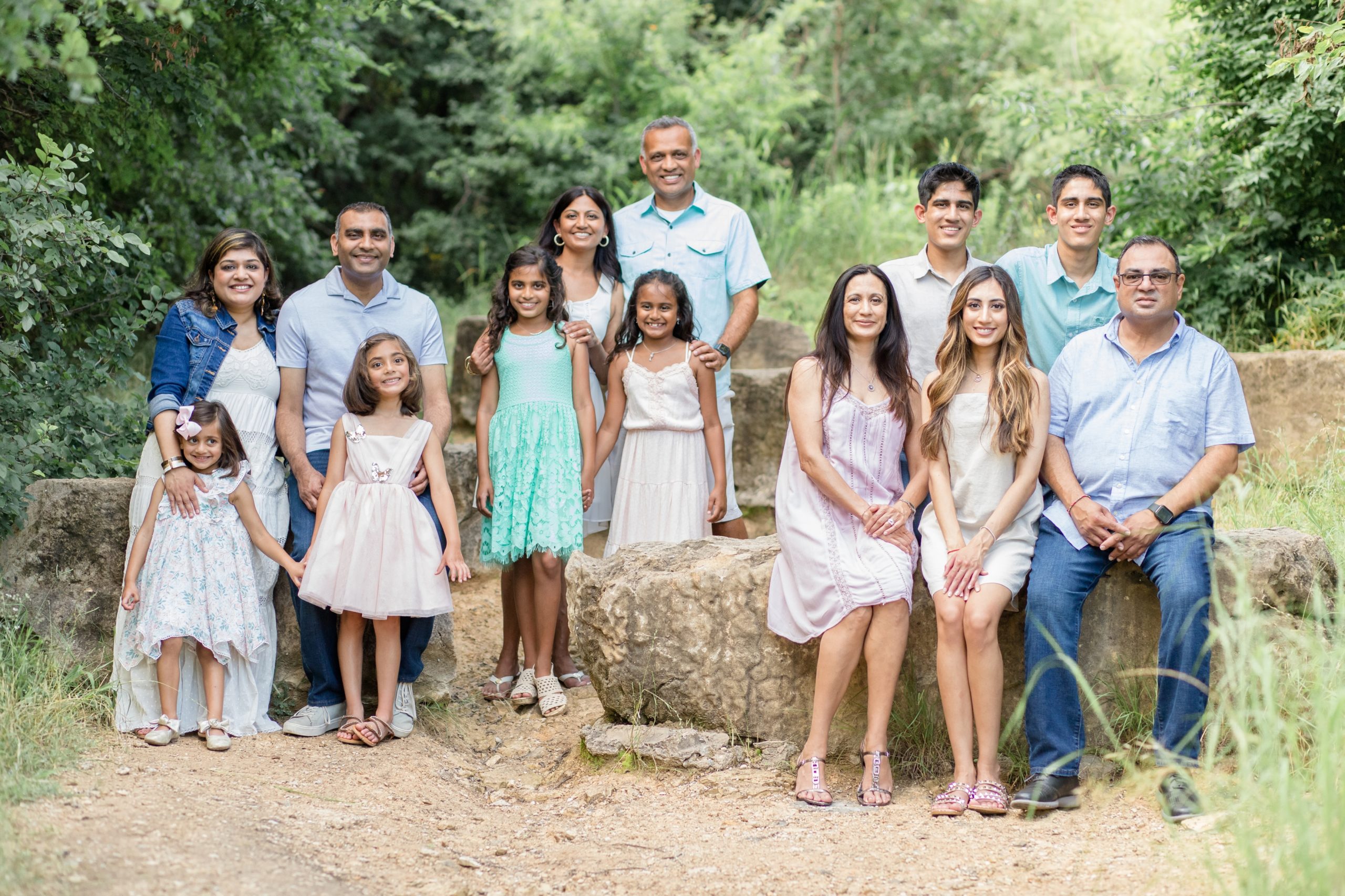 Family poses together during extended family portrait session in the spring at Arbor Hills Nature Preserve in Plano, TX with family photography team Wisp + Willow Photography Co. Click to see more from this sweet session on our blog now!
