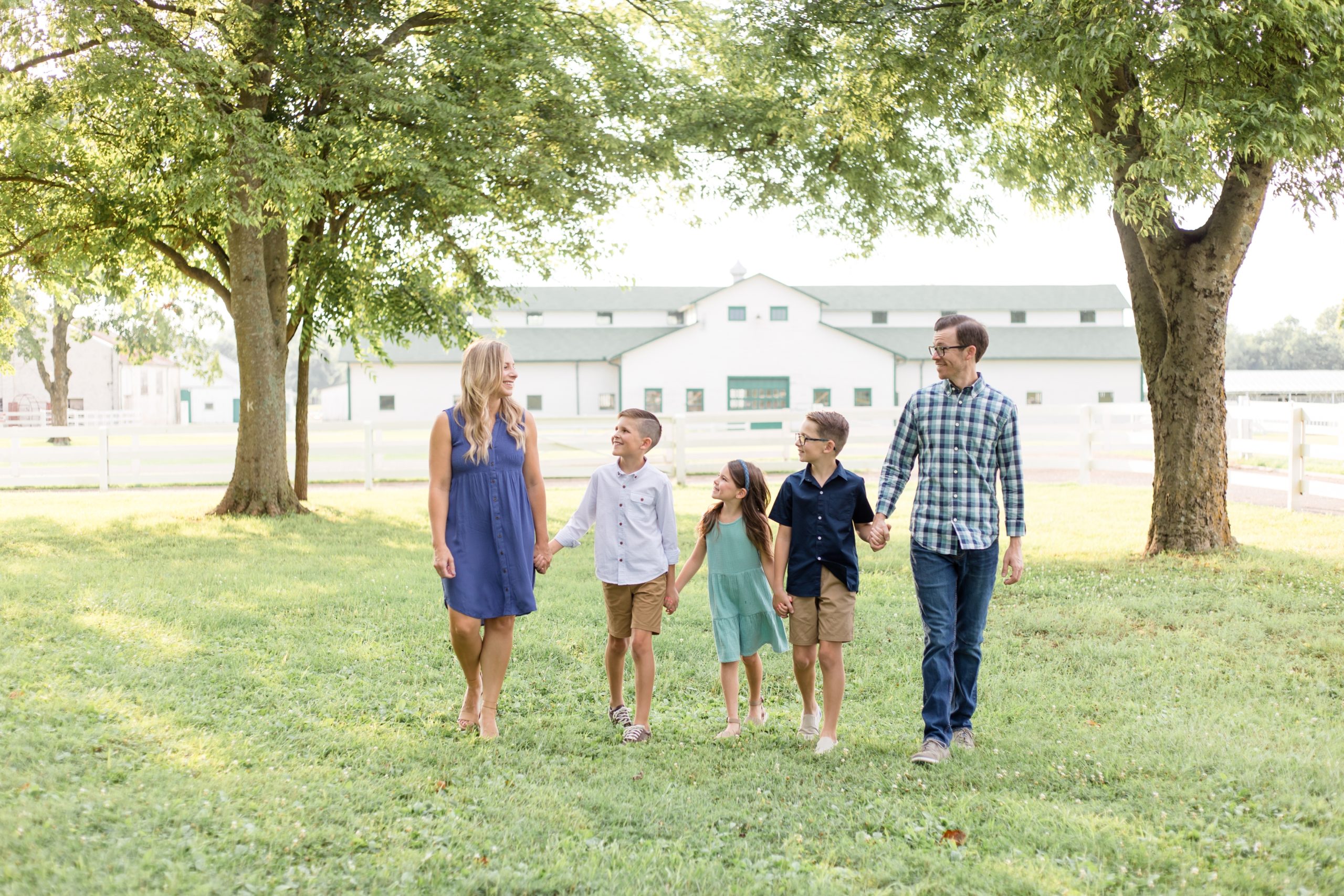 Family of 5 walks hand in hand during full family portrait session at Harlinsdale Farm with family photography team Wisp + Willow Photography Co. Today on the blog we're talking about why choosing a full session might be best for your family! Click to read more! 