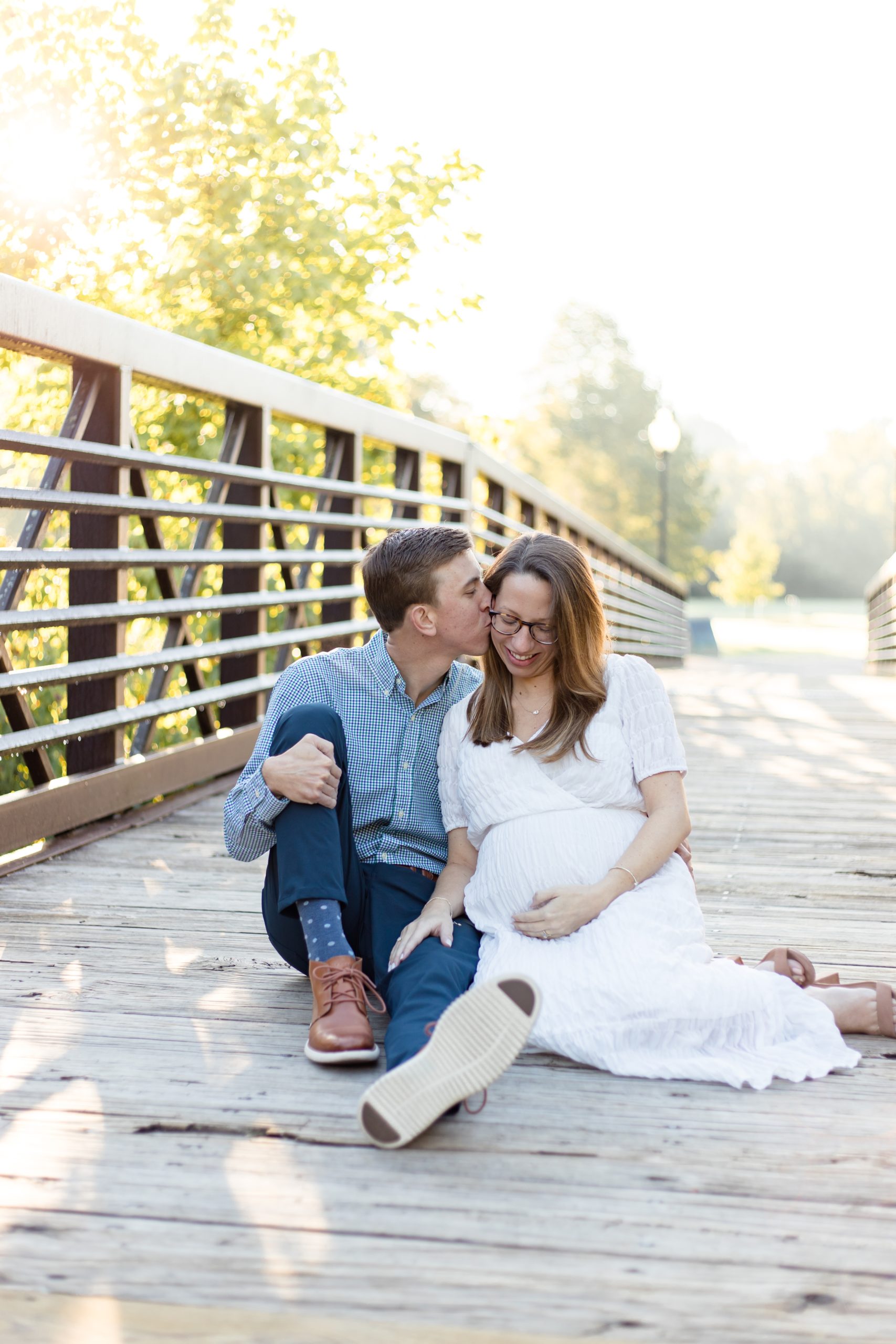 Expecting parents pose during maternity session with family photography team Wisp + Willow Photography Co. Today on the blog we're talking about why choosing a full session might be best for your family! Click to read more! 