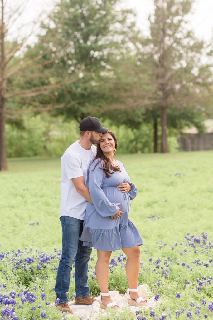 Maternity portraits in bluebonnet field in the spring with maternity photographer 