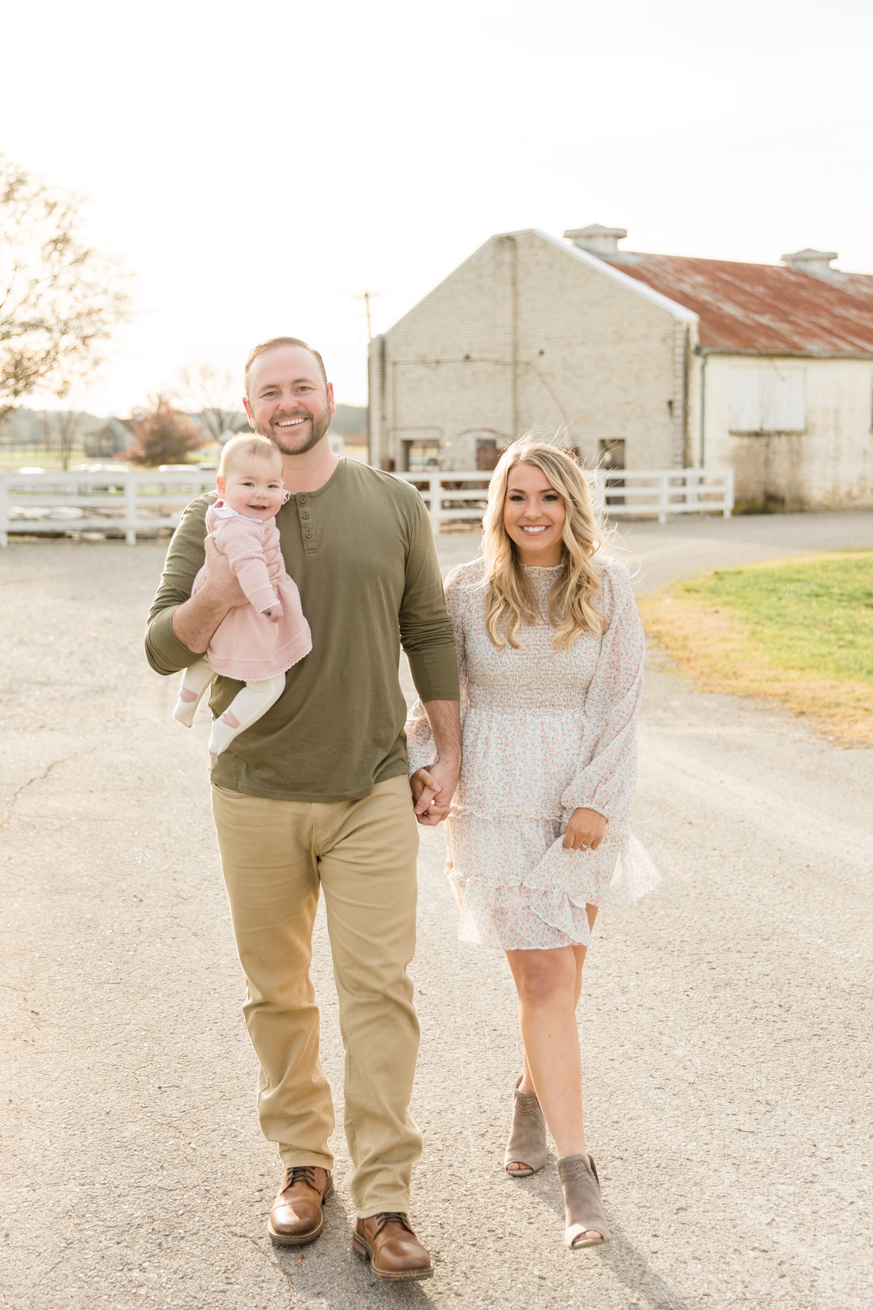 Family of 3 walks along dirt road at Harlinsdale Farm during fall family session with family photography team Wisp + Willow Photography Co. Click to learn more about why we LOVE Harlinsdale Farm! 