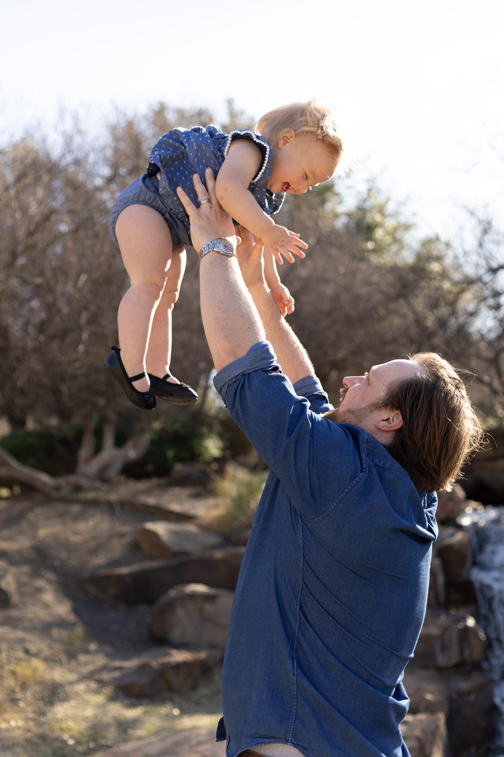Dad plays with daughter during family maternity session at Frisco Central Park with Wisp + Willow Photography Co. Click to read more from this session live on the blog now! 