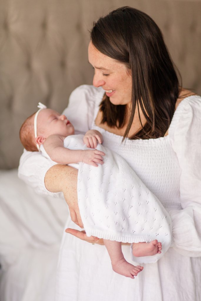 Raleigh family photographer captures in home lifestyle newborn session in the spring 