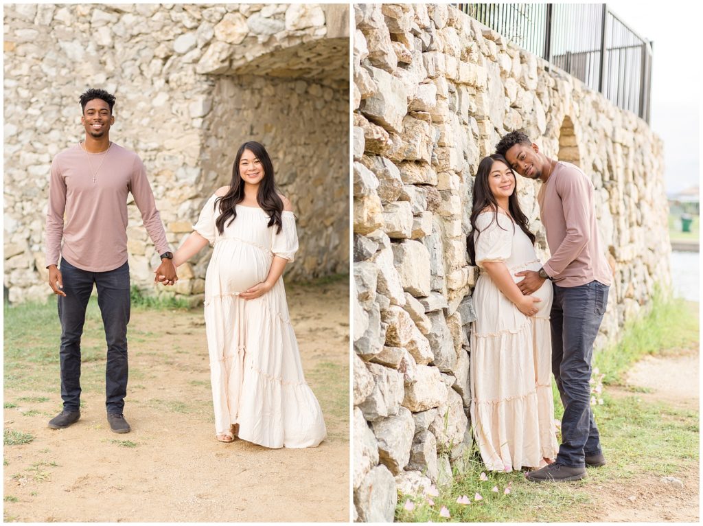 Couple holding hands and walking with stone bridge in the background also pictured head to head with mom leaning against stone bridge. Mom is wearing long cream dress and dad is dressed in blue jeans and dusty rose long sleeved shirt. Maternity session shot in McKinney, TX | Wisp + Willow Photography Co.