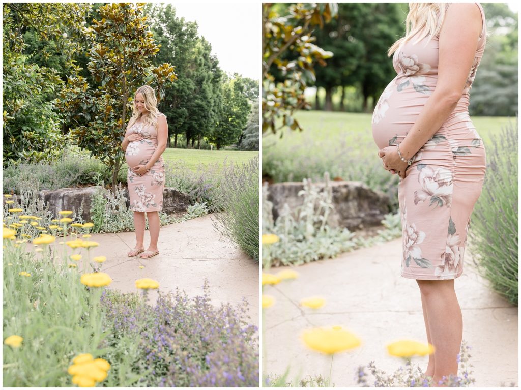 Mom is pictured on a path with magnolia trees and various plant life at Botanical Gardens| Knoxville, TN | Wisp + Willow Photography Co. Mom is wearing a blush pink floral sleeveless dress and white sandals.