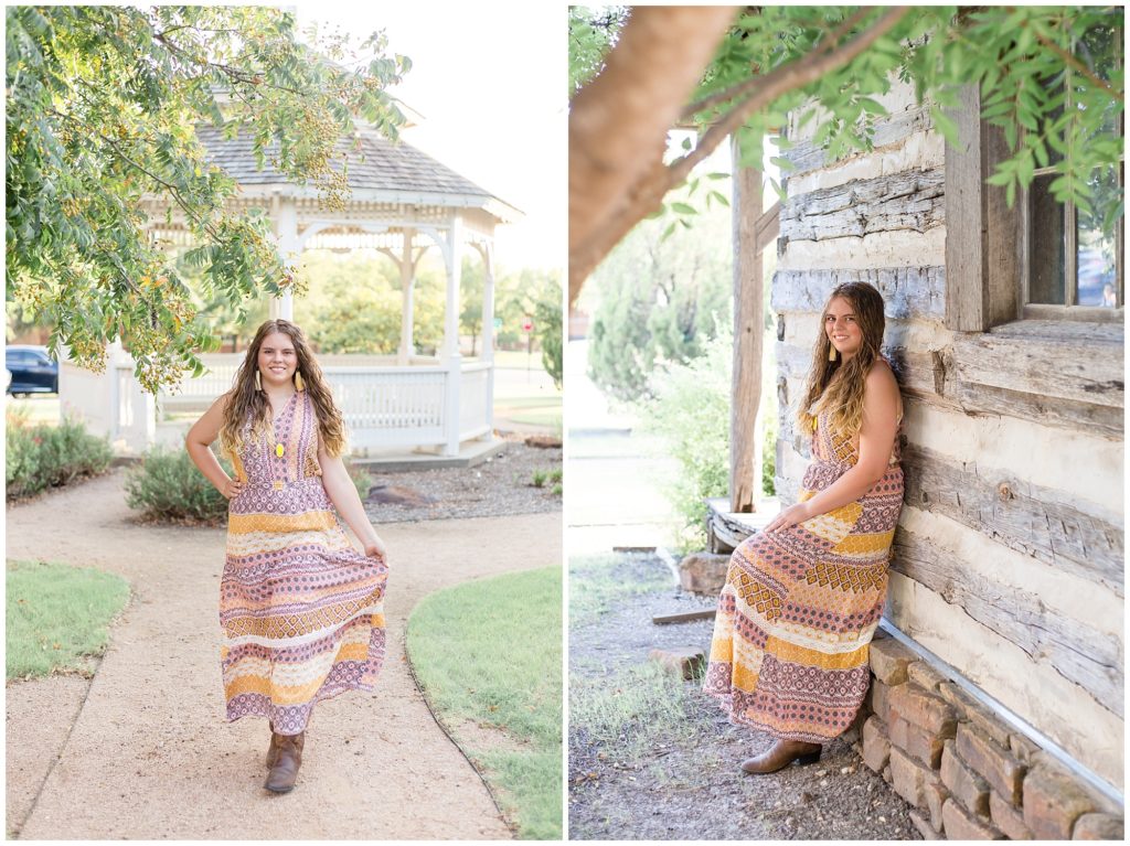 The client is walking down a gravel path with an adorable gazebo in the background. She is also leaning against a wooden house with a beautiful large pane window. She is wearing a beautiful long, sleeveless multi-colored bohemian style dress with cowboy boots and a long necklace with a bright yellow pendant and dangle fringe earrings.