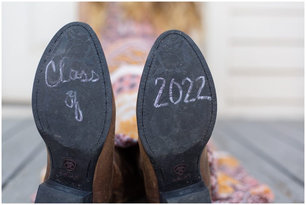 The client has written class of 2022 in this clever picture of the bottom of her cowboy boots.
