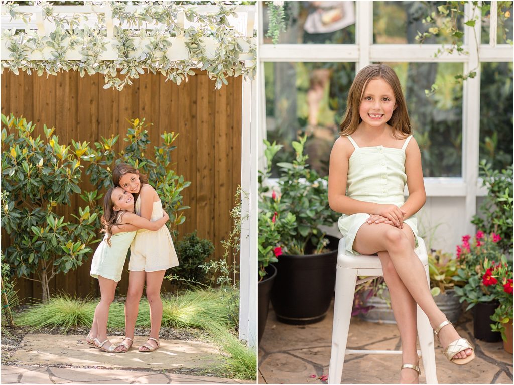 Sisters are standing outside and sharing a hug. 1st sister is wearing a short sleeveless romper and gold sandals. 2nd sister is wearing a short sleeveless pale yellow romper and gold sandals.
Sister wearing a mint-colored short sleeveless romper and set on a white stool. 