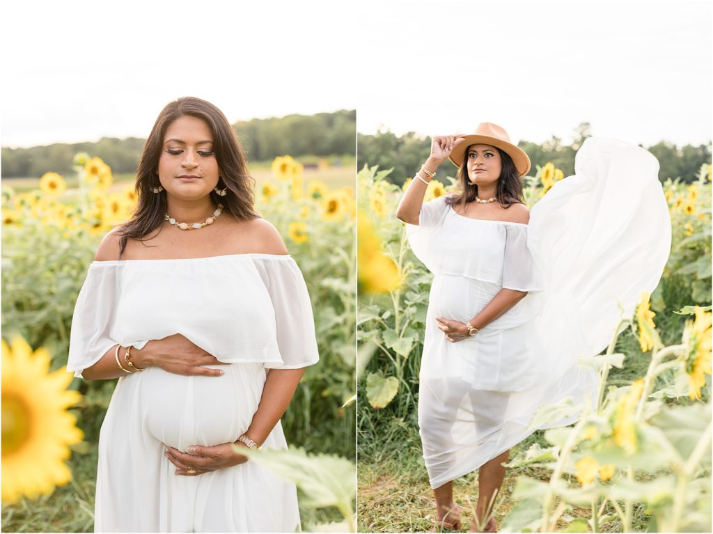 This gorgeous mom-to-be is standing in a field of sunflowers. She is wearing an off-the-shoulder white dress and a tan hat.