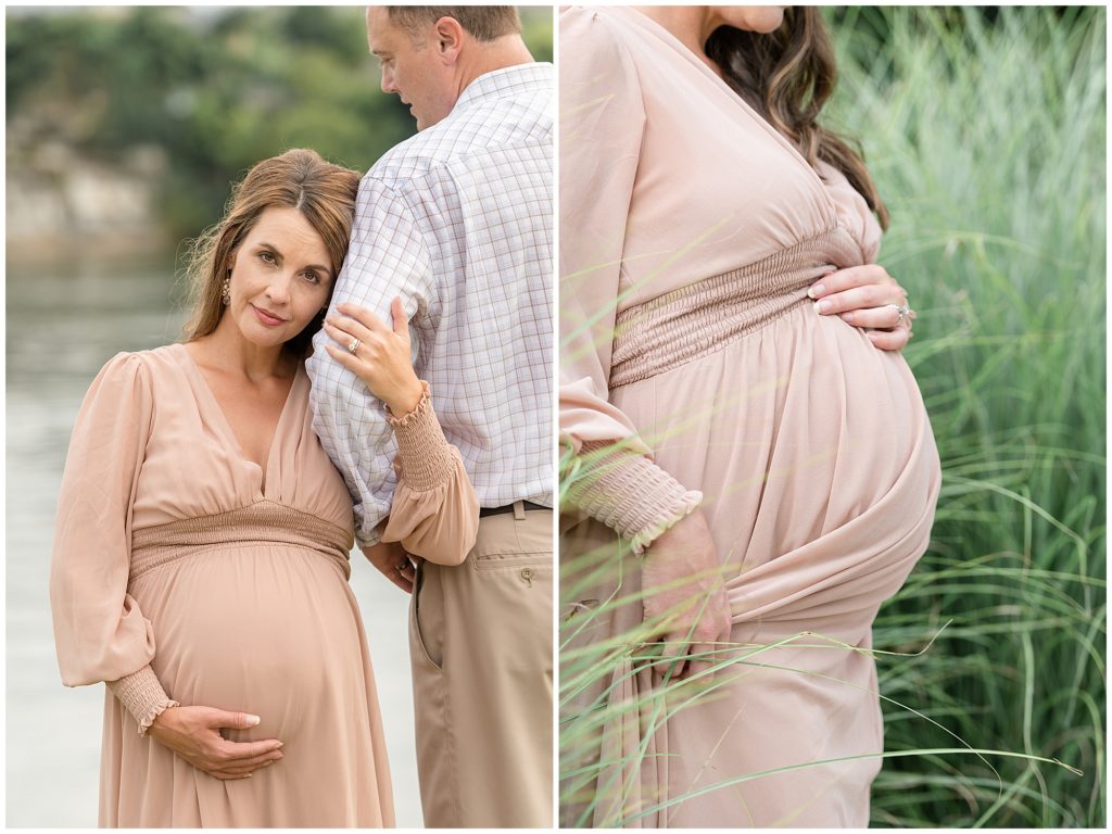 Expectant woman in flowy blush dress gently touches belly while holding onto husband's arm in Chattanooga, TN during family maternity session. 