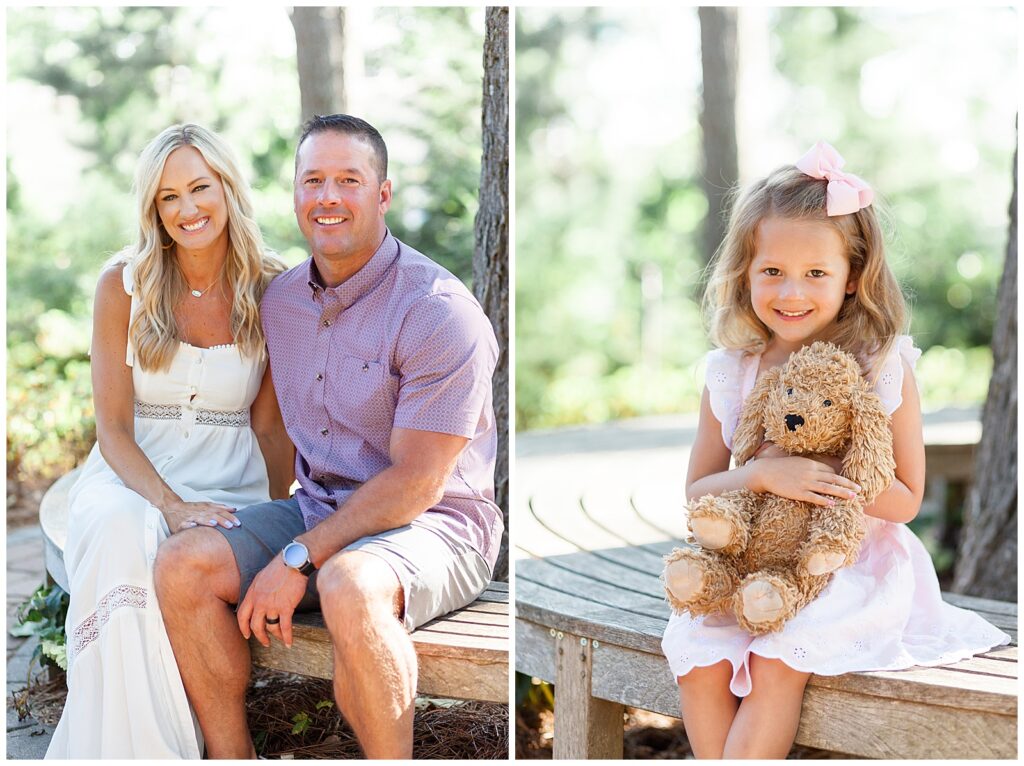 Mom and Dad smile at the camera in white dress and a purple shirt and grey shorts for the husband during their family photography session with Wisp + Willow Photography Co.  Their daughter smiles at camera with her doodle stuffed animal.