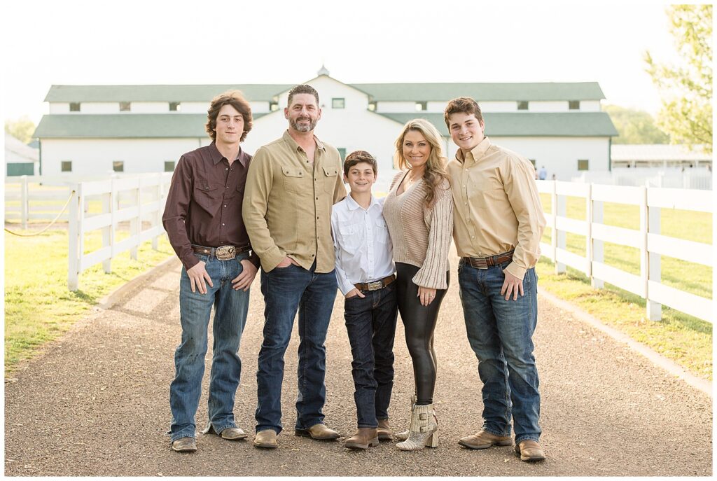 Franklin family photographer, Wisp + Willow Photography Co. captures family of 5 in their cowboy books and neutral colored outfits.