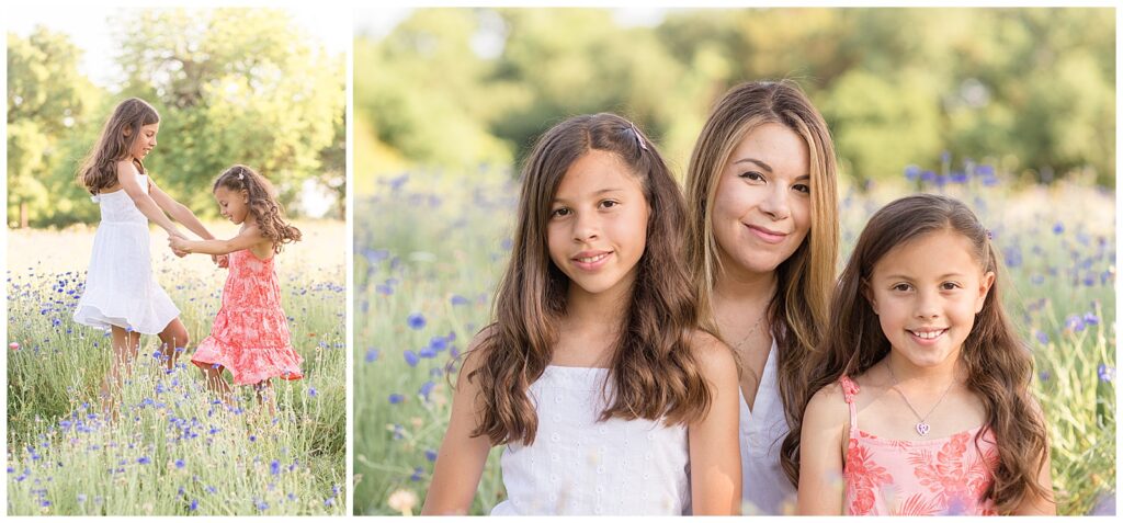 Two sisters twirl together in wildflower field as they hold hands.  Mother with two beautiful daughters smile at the camera of Wisp + Willow Photography Co.