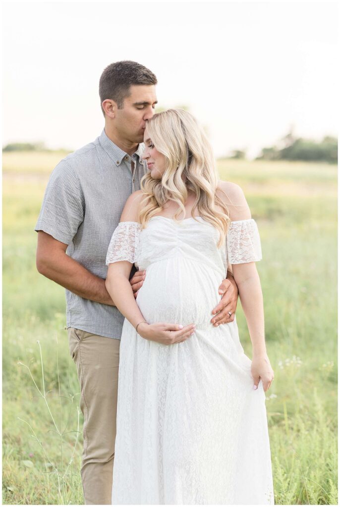 McKinney Maternity Photographer, Wisp + Willow Photography Co., stand in a field at Erwin Park and take maternity portraits.  Click to see more of this beautiful maternity session on the blog today!