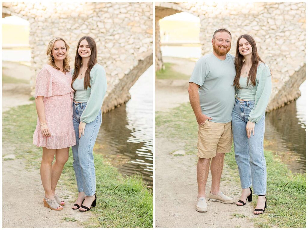 Oldest daughter takes individual pictures with her mom and dad during their family session at Adriatica Village with Wisp + Willow Photography Co.