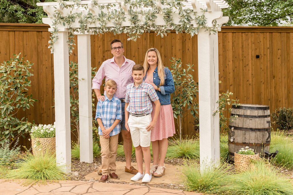 Family of 4 poses during spring minis with McKinney family photographer Wisp + Willow Photography Co.
